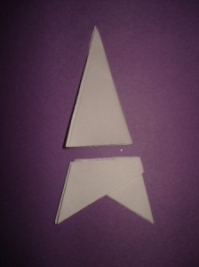 SnowflakeStep6 6. Cut a straight line across the bottom.